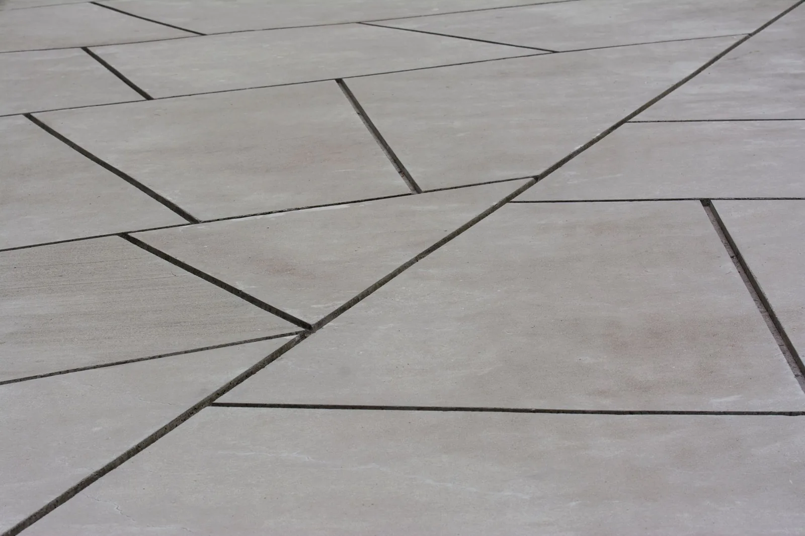 Concrete worker smoothing a freshly poured slab
