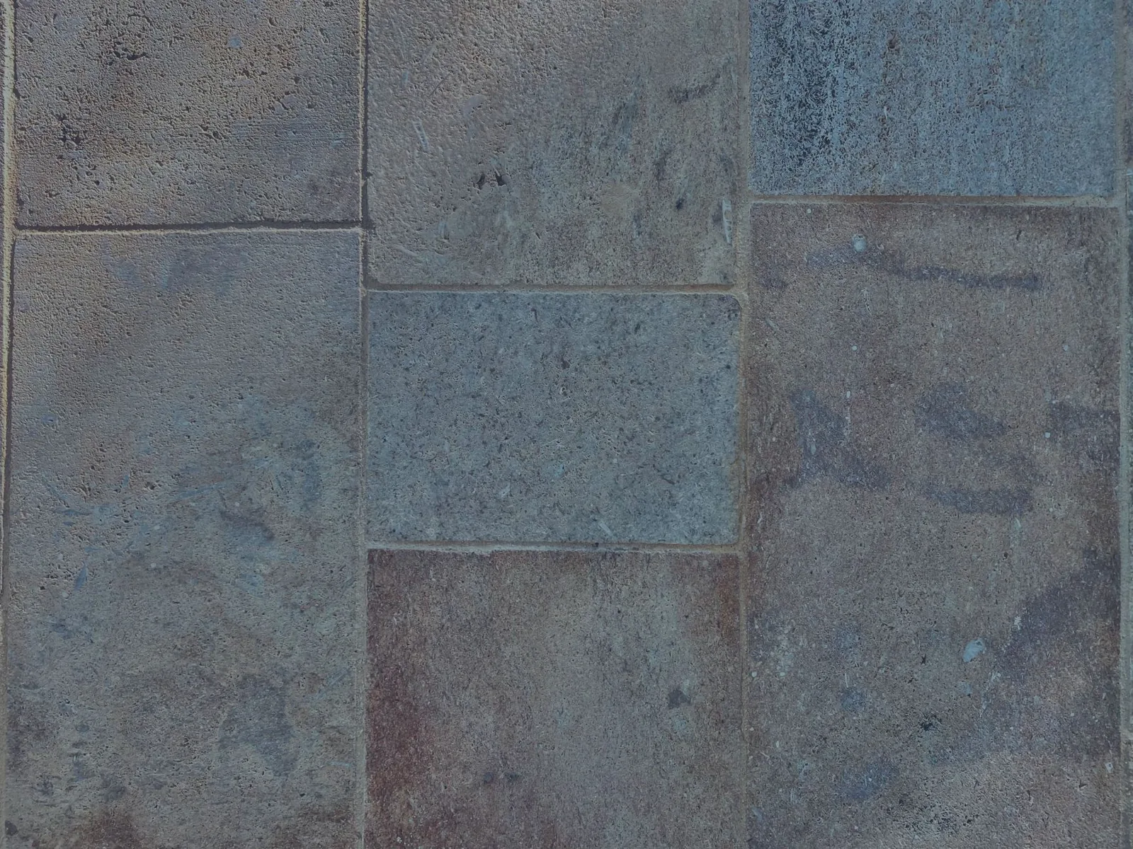 A freshly poured 20x20 concrete slab with a smooth trowel finish