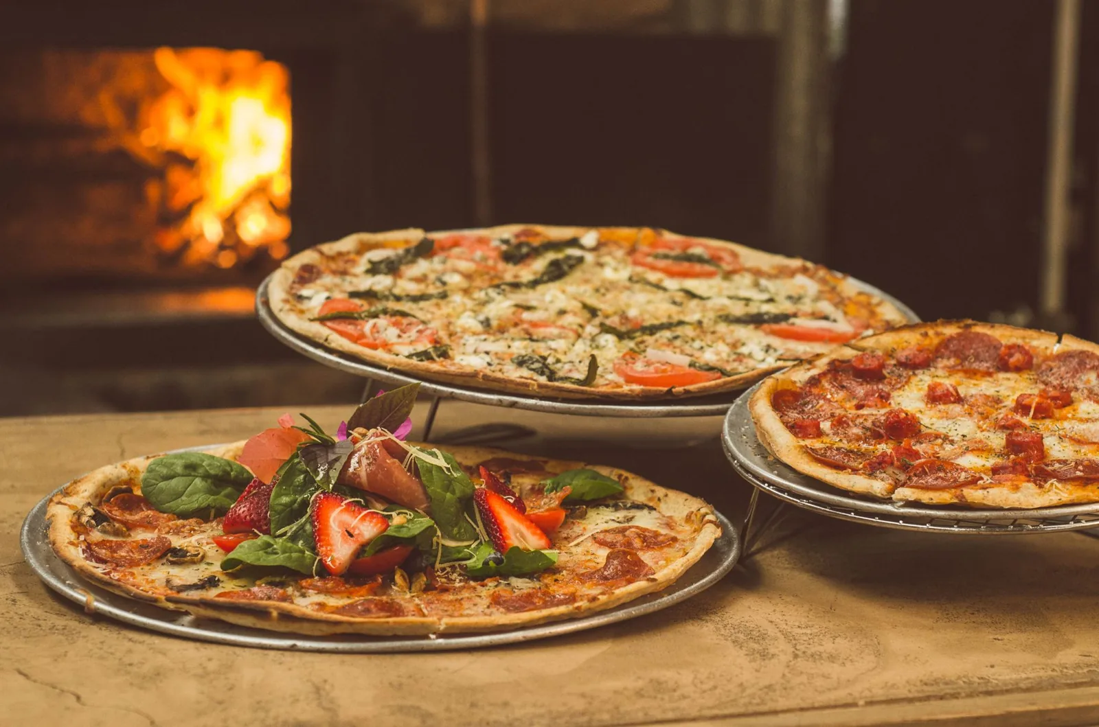 How much does it cost to build a pizza oven uk — a brick pizza oven under construction in a garden